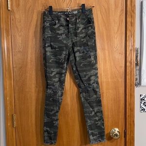 Camouflage jeans with a few rips